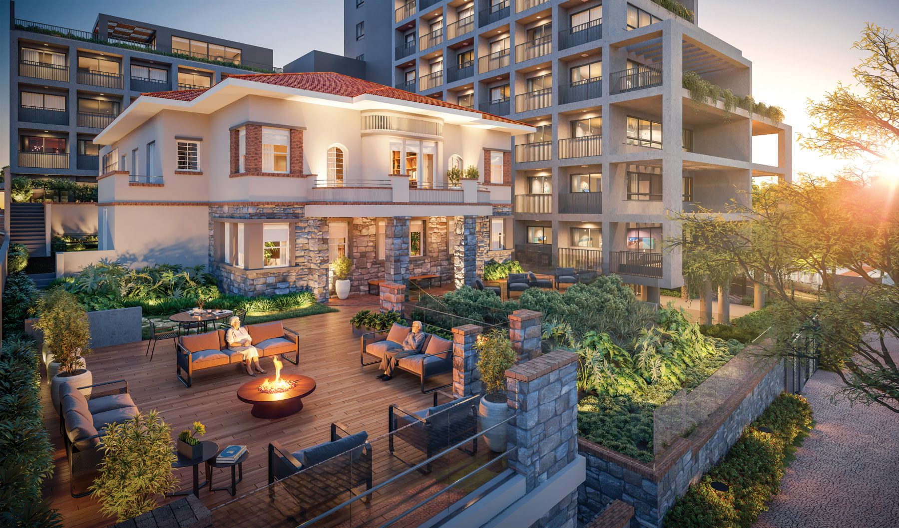 Jardim e deck externo com lareira ao entardecer